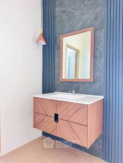 Modern bathroom with stylish vanity and elegant lighting
