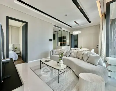 Modern living room with sleek design and elegant furniture in a contemporary apartment.