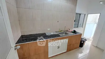 Modern kitchen with sleek countertops and ample storage space