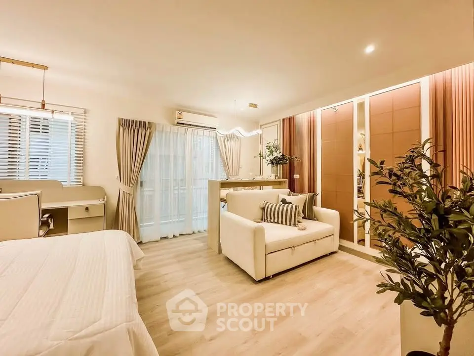 Spacious modern bedroom with elegant decor and natural light