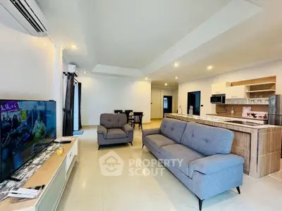 Spacious modern living room with open kitchen and stylish furniture
