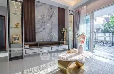 Luxurious living room with elegant decor and large windows for natural light.