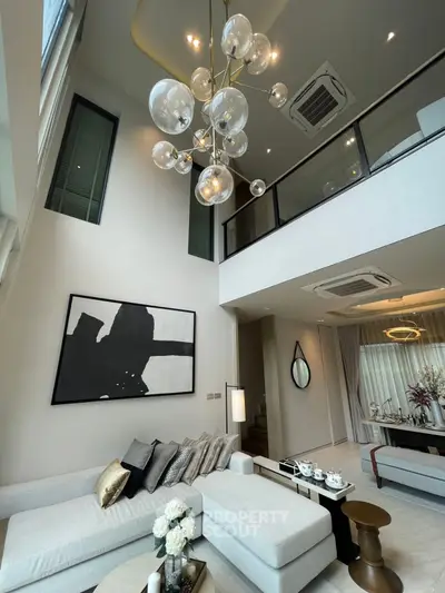 Luxurious modern living room with high ceiling and elegant decor