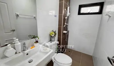 Modern bathroom with sleek fixtures and stylish decor in a contemporary home.