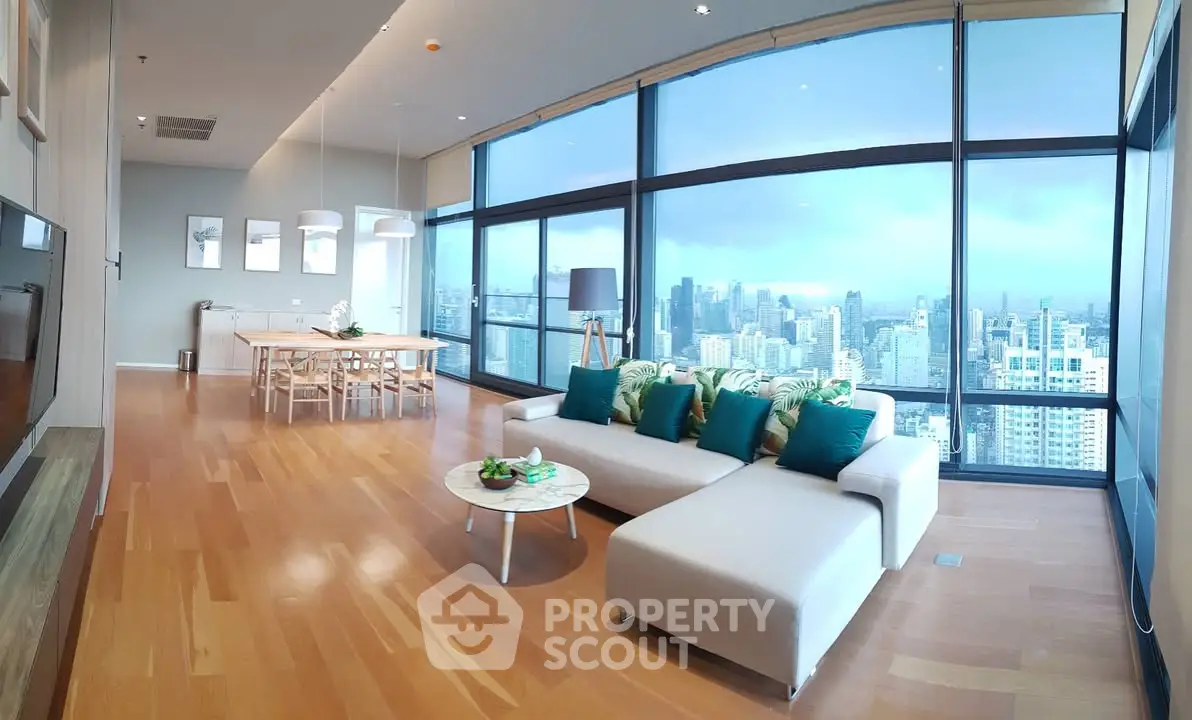 Spacious modern living room with panoramic city view and elegant decor