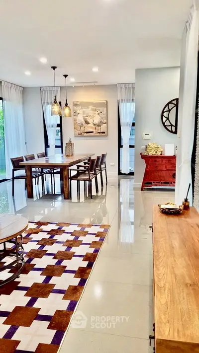 Spacious modern living room with elegant dining area and stylish decor