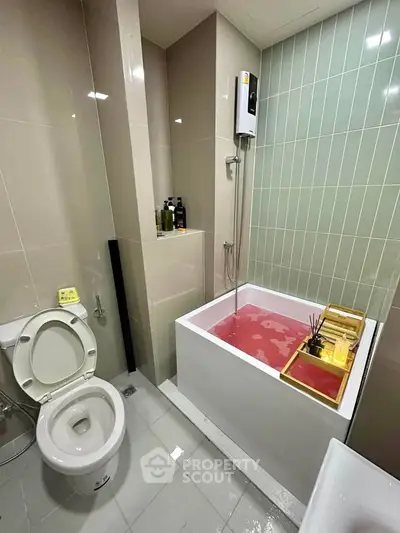 Modern bathroom with compact bathtub and sleek design