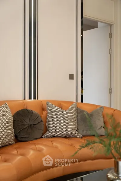 Luxurious modern living room with stylish leather sofa and decorative pillows