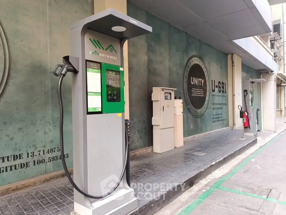 Modern electric vehicle charging station in urban setting with sleek design and convenient access.