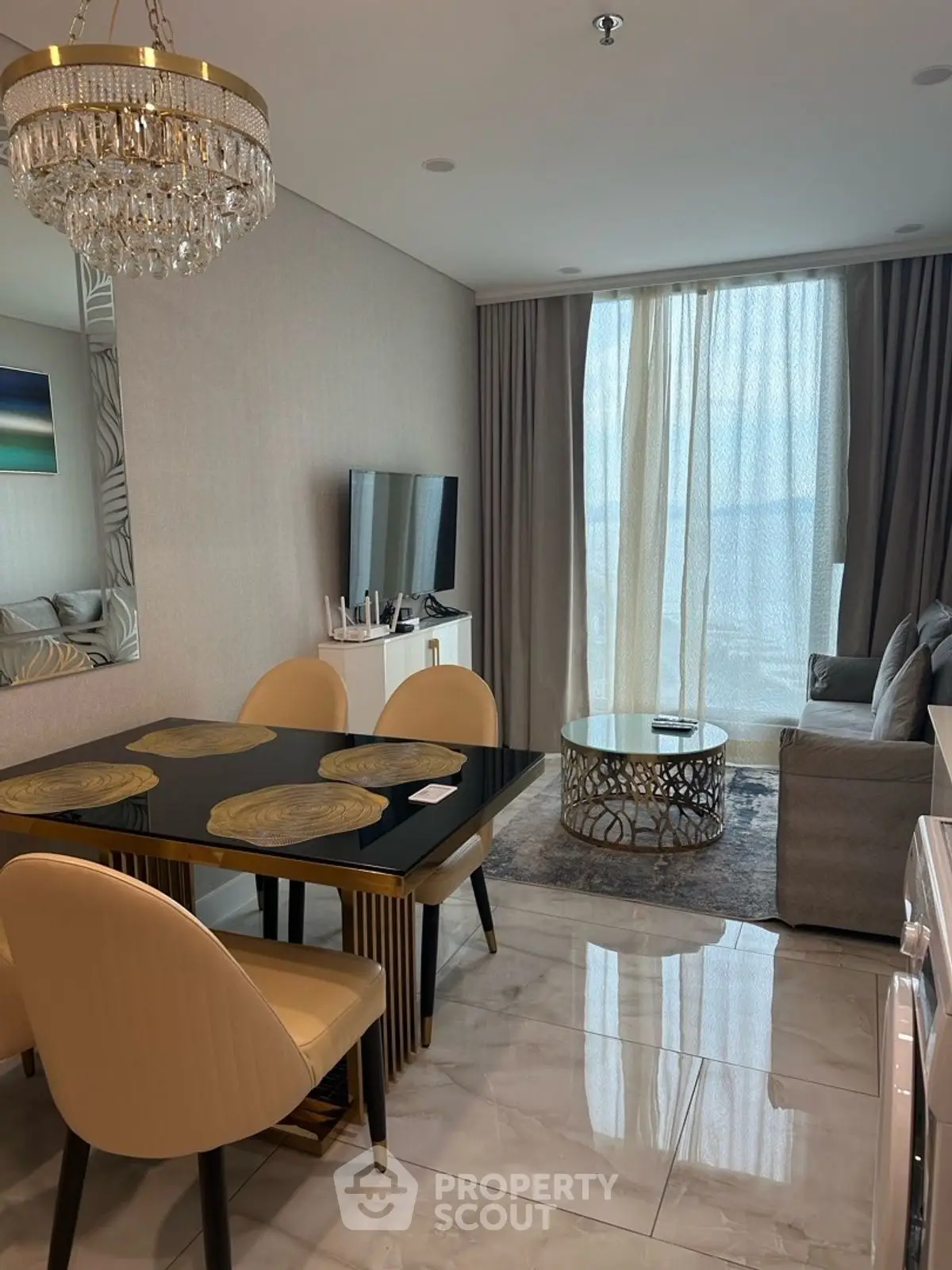 Luxurious modern living room with elegant chandelier and stylish furniture