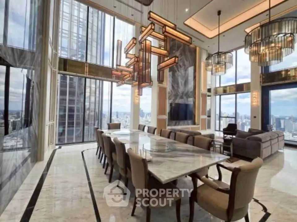 Luxurious high-rise living room with panoramic city views and elegant modern decor.