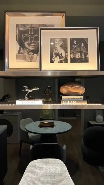 Stylish modern living room with chic decor and elegant artwork display.