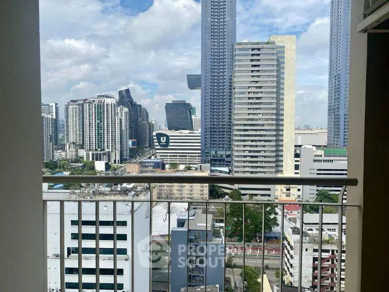Stunning cityscape view from a high-rise balcony in urban setting.