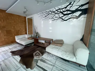 Stylish living room with modern decor and unique wall art