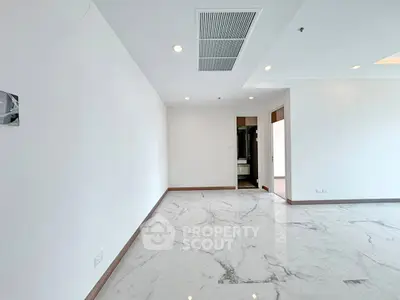 Spacious modern interior with marble flooring and recessed lighting, ideal for customization.