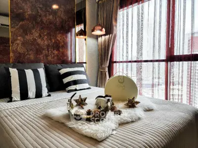 Luxurious bedroom with elegant decor and city view through large windows.