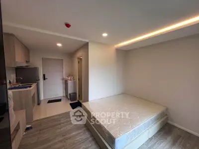 Modern studio apartment with open layout and stylish kitchen
