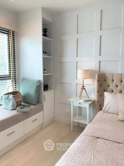 Charming bedroom with elegant panel wall, cozy window seat, and stylish decor