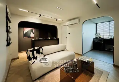 Modern living room with stylish decor and open kitchen layout