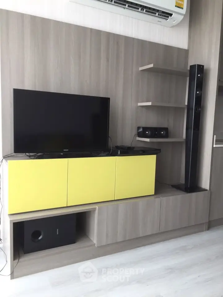 Modern living room with sleek entertainment center and stylish shelving