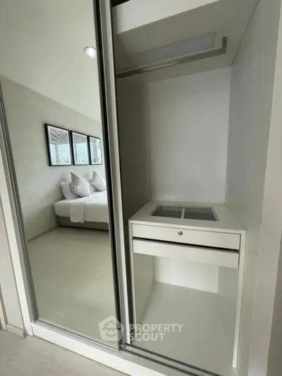 Modern bedroom with sleek built-in closet and stylish decor
