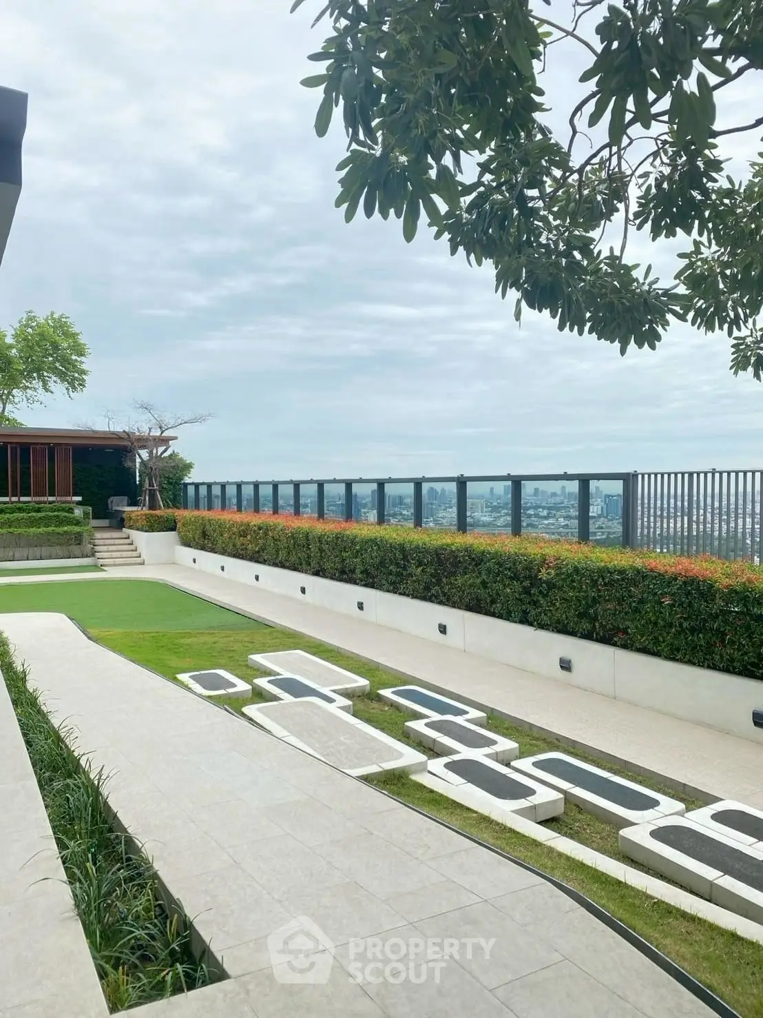 Stunning rooftop garden with panoramic city views and modern landscaping.