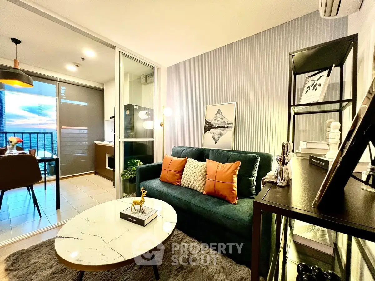 Modern living room with stylish decor and open balcony view