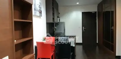 Modern apartment interior with stylish dining area and sleek kitchen design.