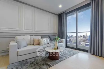 Luxurious living room with stunning city view, elegant decor, and floor-to-ceiling windows.