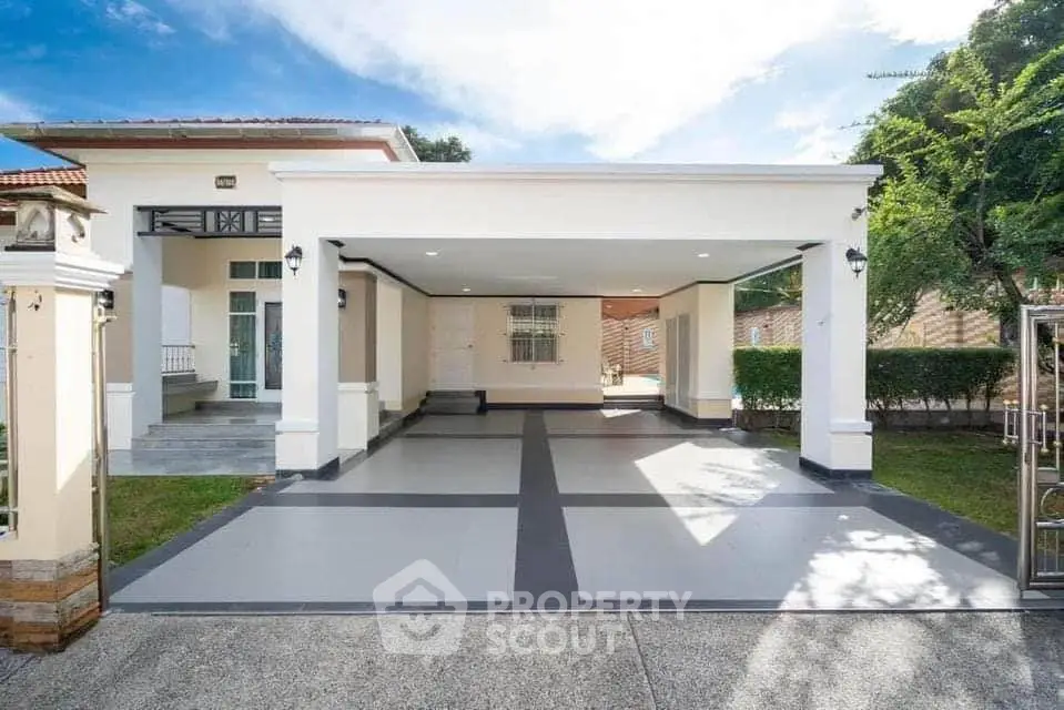 Spacious modern home with large driveway and elegant entrance