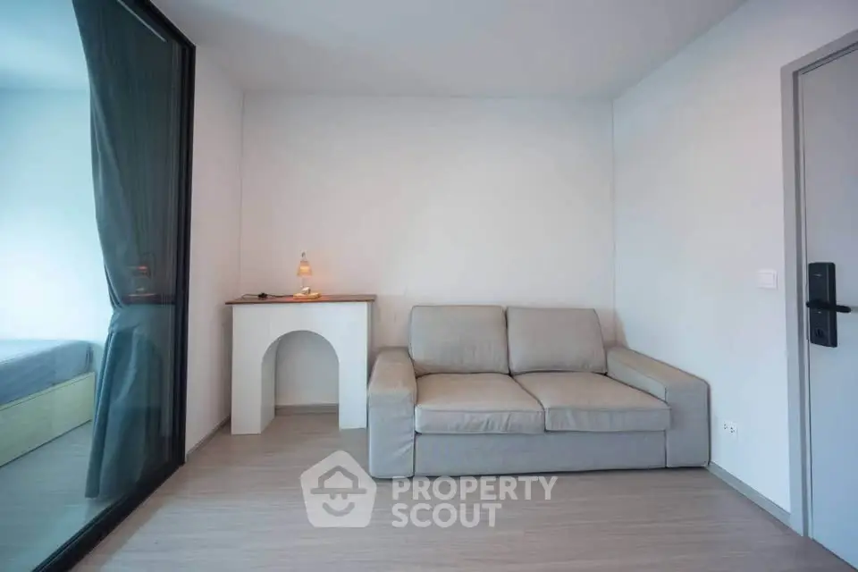 Modern minimalist living room with gray sofa and stylish decor