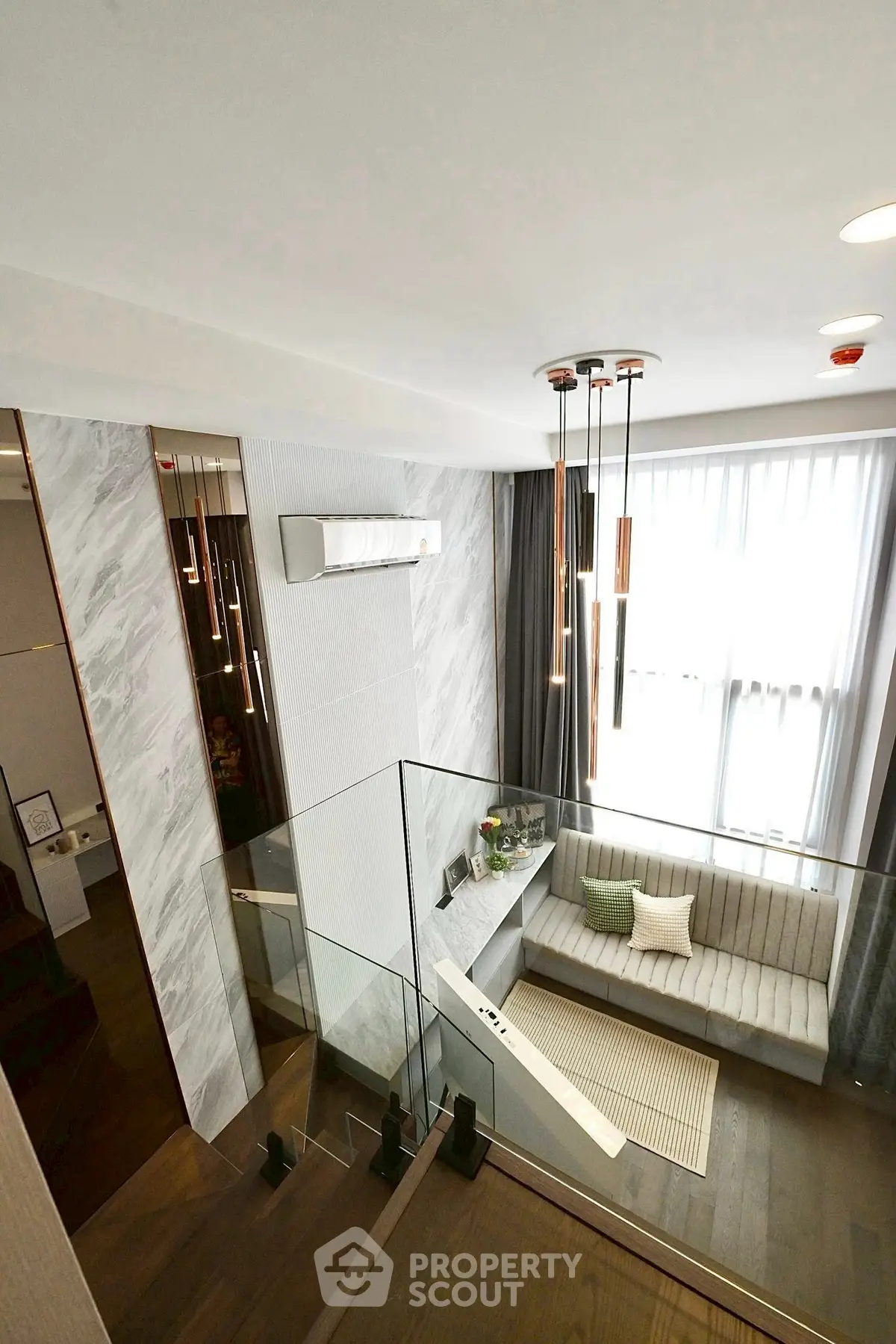 Modern duplex interior with stylish staircase and cozy seating area