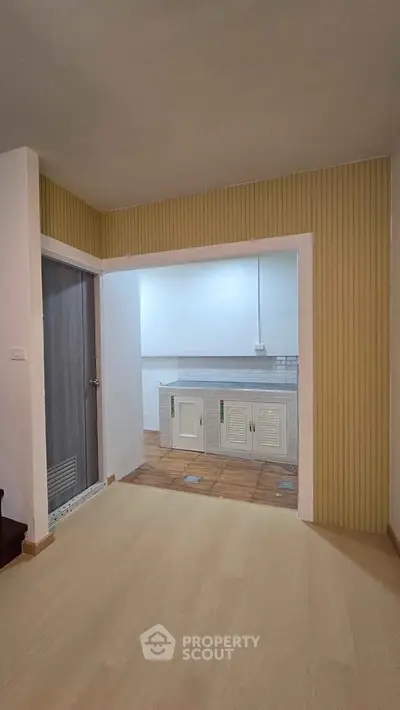 Spacious kitchen with closed layout and modern cabinetry