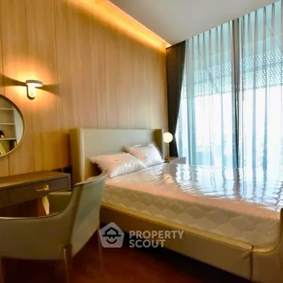 Modern bedroom with elegant decor and large window view