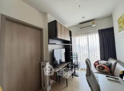 Modern living room with stylish furniture and city view, perfect for urban living.