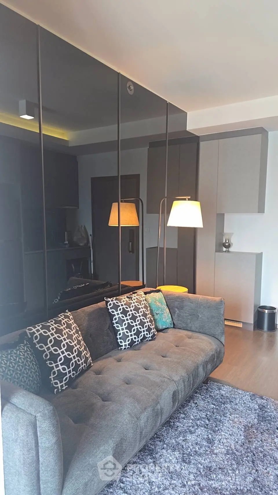 Modern living room with stylish gray sofa and elegant decor