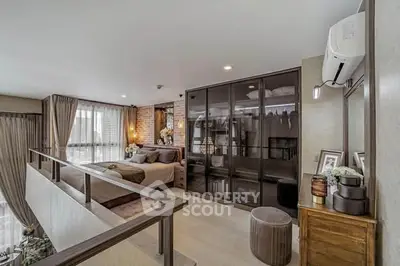 Luxurious loft-style bedroom with modern decor and ample natural light