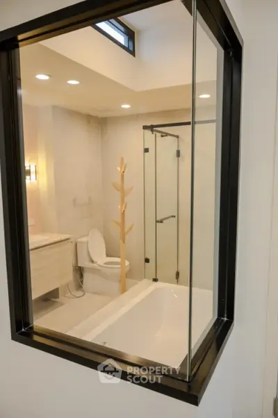 Modern bathroom with glass shower and stylish fixtures