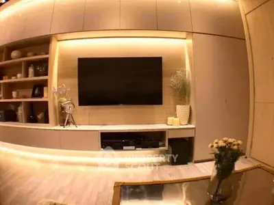 Modern living room with built-in TV and ambient lighting