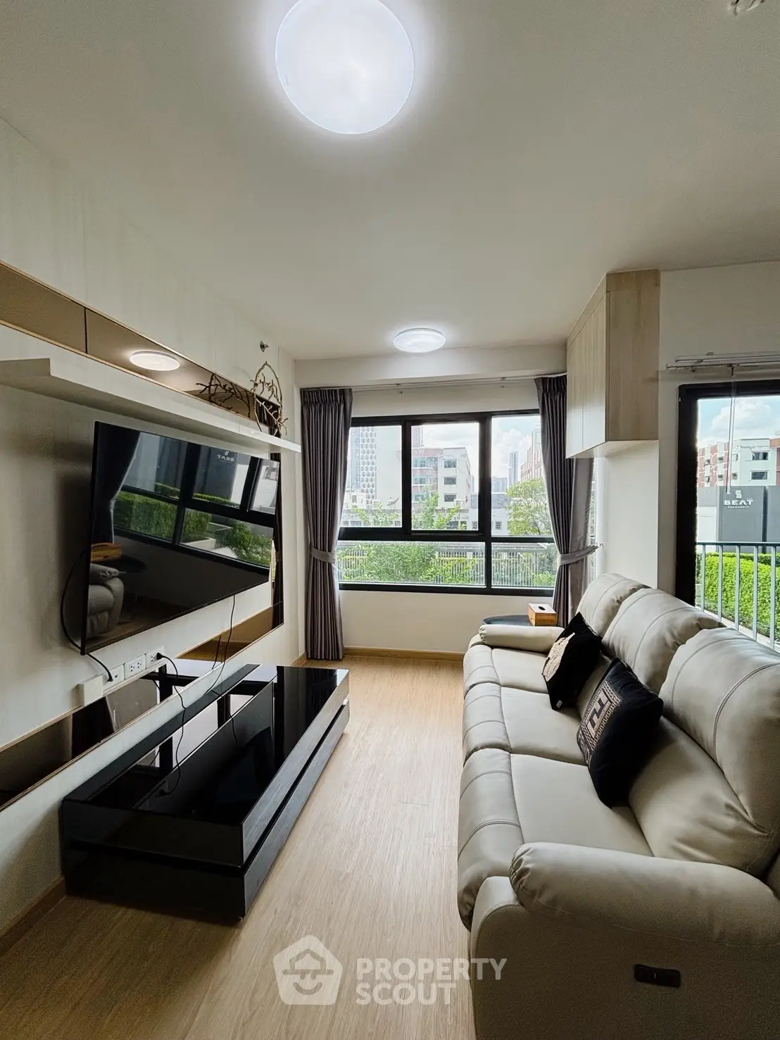 Modern living room with sleek design and large window view
