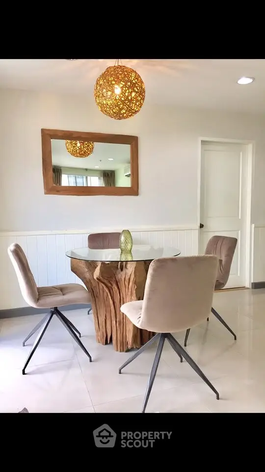 Elegant dining area with unique wooden table and modern chairs, perfect for stylish home interiors.