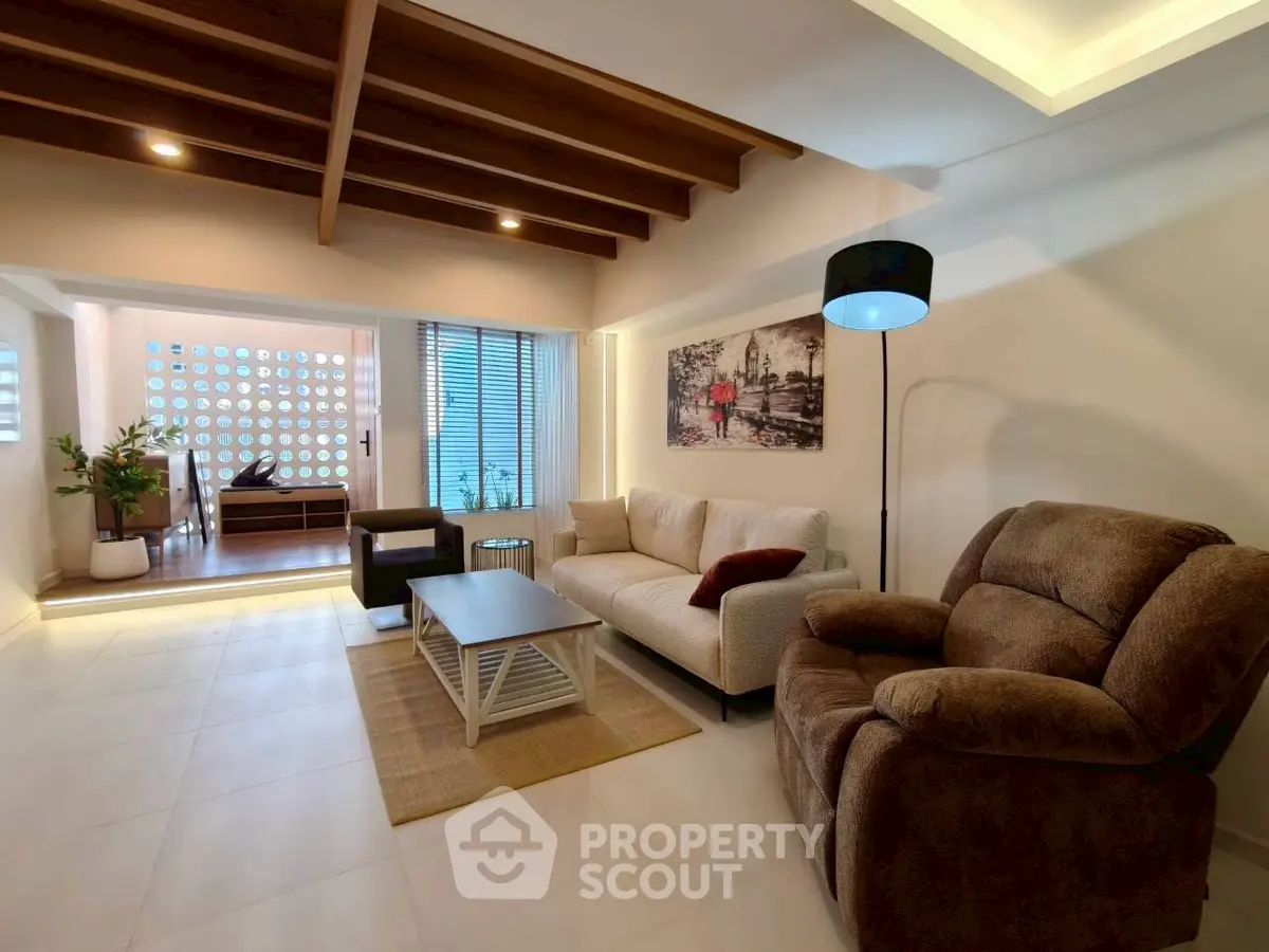 Spacious living room with modern decor and cozy seating area