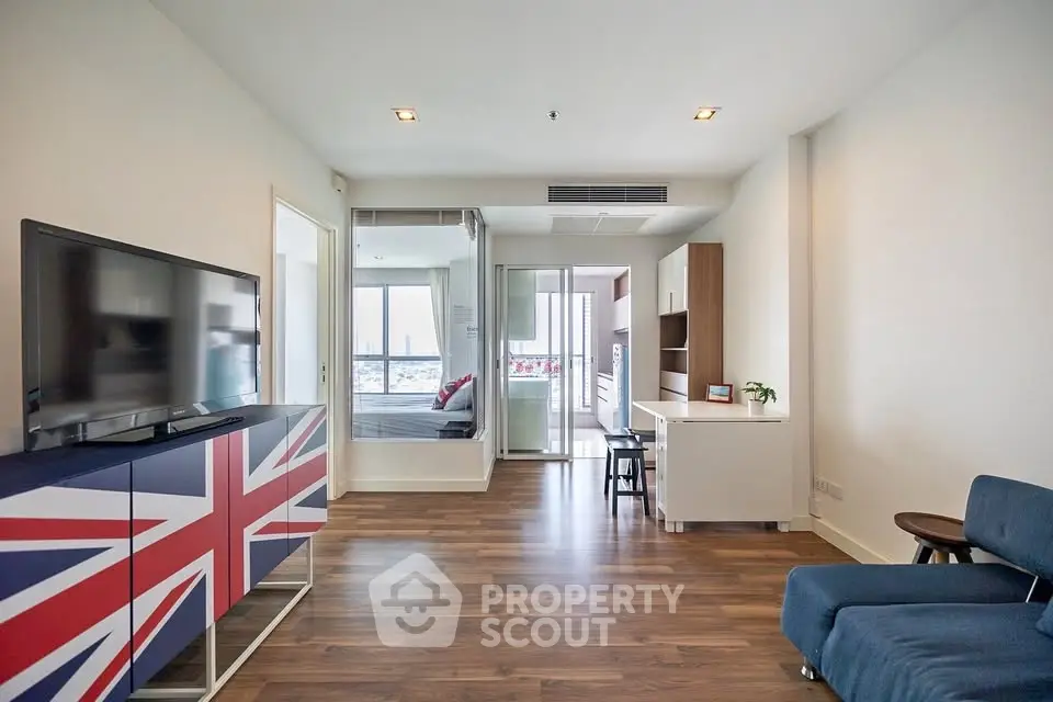 Modern living room with stylish decor and open layout in a high-rise apartment.