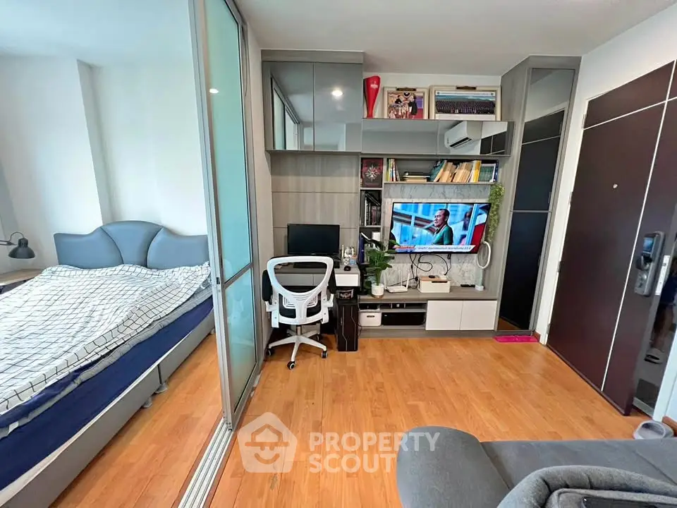 Modern studio apartment with cozy living area and stylish bedroom