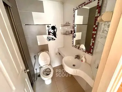 Modern bathroom with stylish decor and sleek fixtures in a contemporary home.