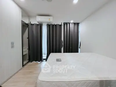 Modern bedroom with minimalist design and large window