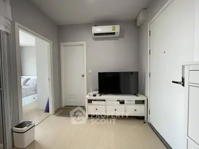 Modern living room with TV and air conditioning in a cozy apartment