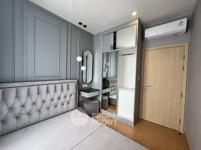 Modern bedroom with stylish decor and built-in wardrobe in a contemporary apartment.