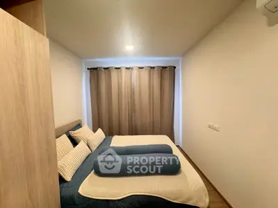 Cozy bedroom with modern decor and soft lighting, perfect for relaxation.