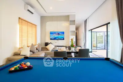Luxurious living room with pool table and modern decor